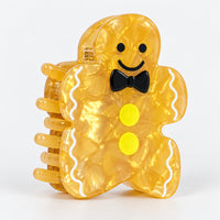 Gingerbread man Christmas claw hair clip with a bow tie and yellow buttons