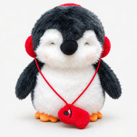 Christmas penguin plushie with red earmuffs and a red mitten necklace