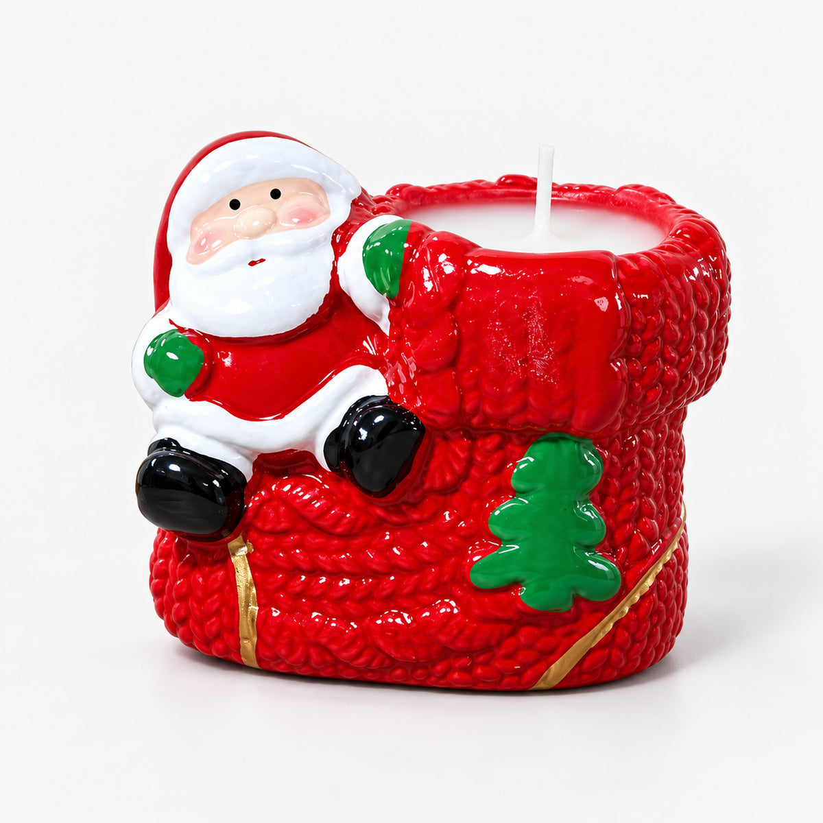Santa boot candle: red knitted-look boot with a Santa figure, a green tree and a white candle