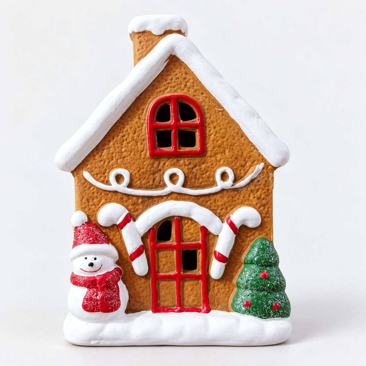 Gingerbread Christmas house with a snowman, candy canes and a Christmas tree
