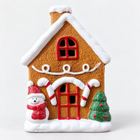 Gingerbread Christmas house with a snowman, candy canes and a Christmas tree