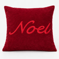 Red Christmas throw pillow with a raised Noel script