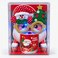 Christmas mug gift box with red seated Santa design and light-up glasses switched on