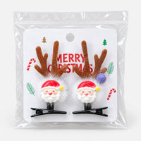 Santa antler Christmas hair clips on a Merry Christmas card