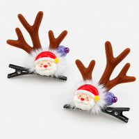 Pair of Christmas antler hair clips with Santa faces
