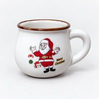 White large rounded Christmas mug with a Santa arms up print and gold Merry Christmas