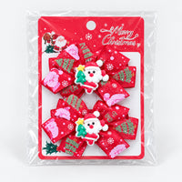 Santa Christmas bow hair clips on a Merry Christmas card