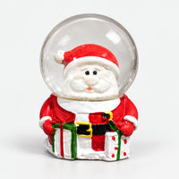 Santa Christmas snow globe holding red and green gifts