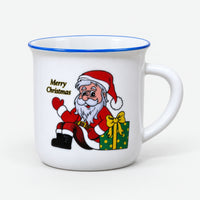 White Christmas mini mug with a blue rim and Santa next to a green gift