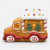 Gingerbread truck Christmas decoration with a white icing roof and swirl wheels
