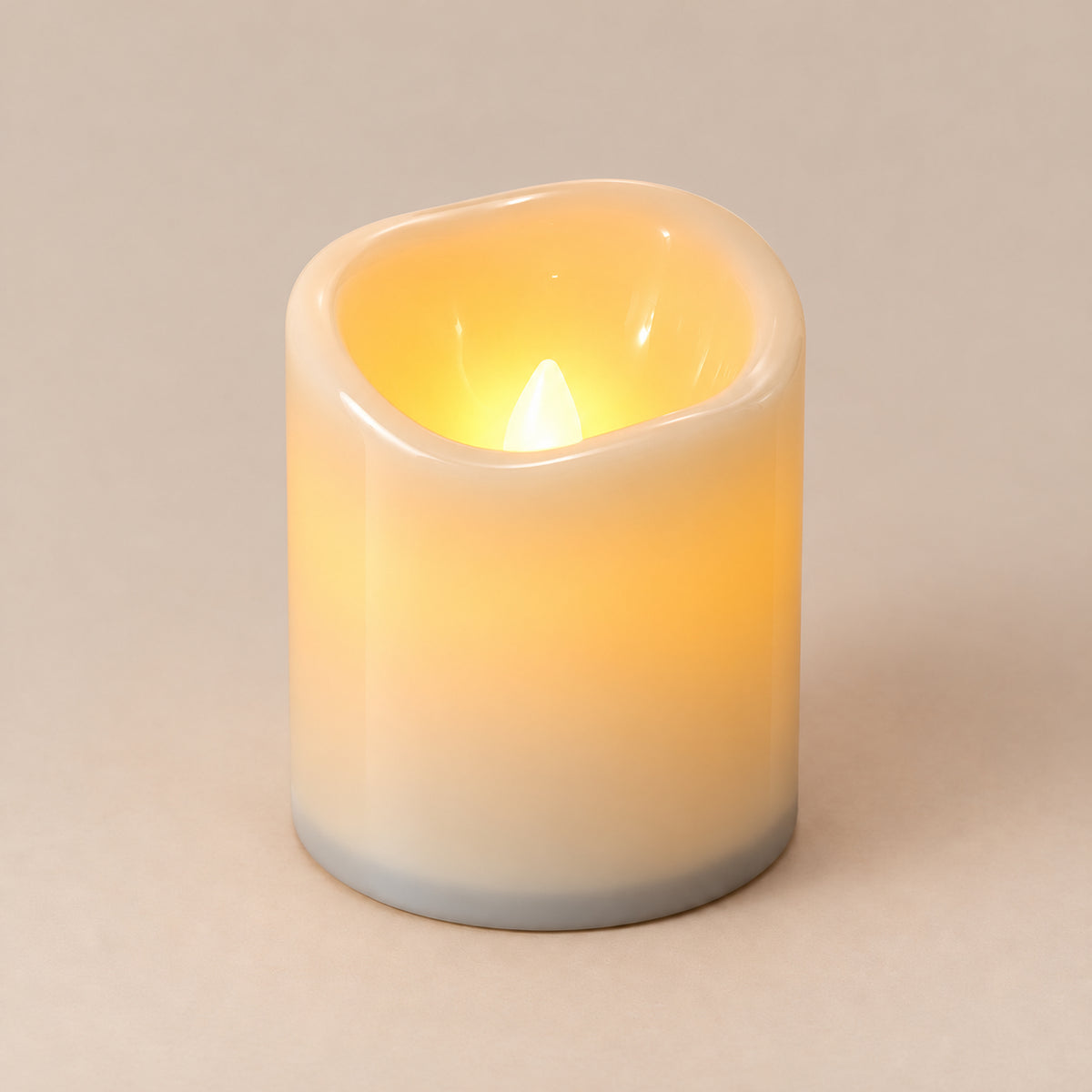 Ivory LED pillar candle, 9 cm, switched on with a warm flickering flame