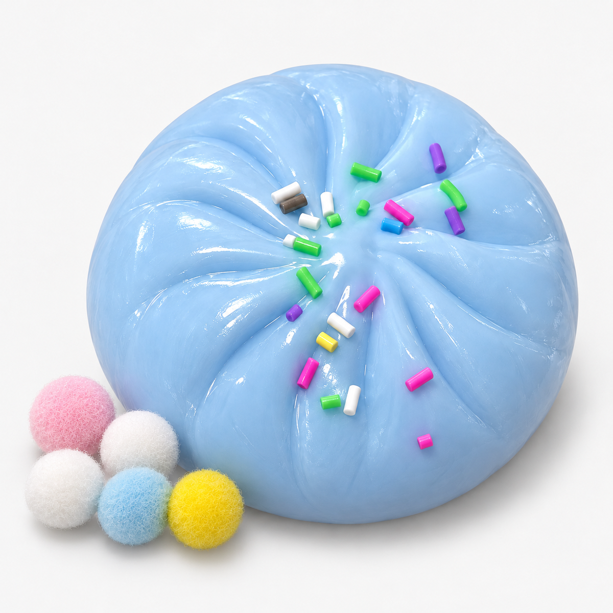 Dumpling squishy in blue with sprinkles and fuzzy pompoms