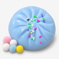 Dumpling squishy in blue with sprinkles and fuzzy pompoms