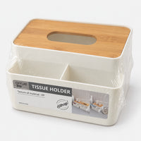 Tissue box holder with organizer in its packaging