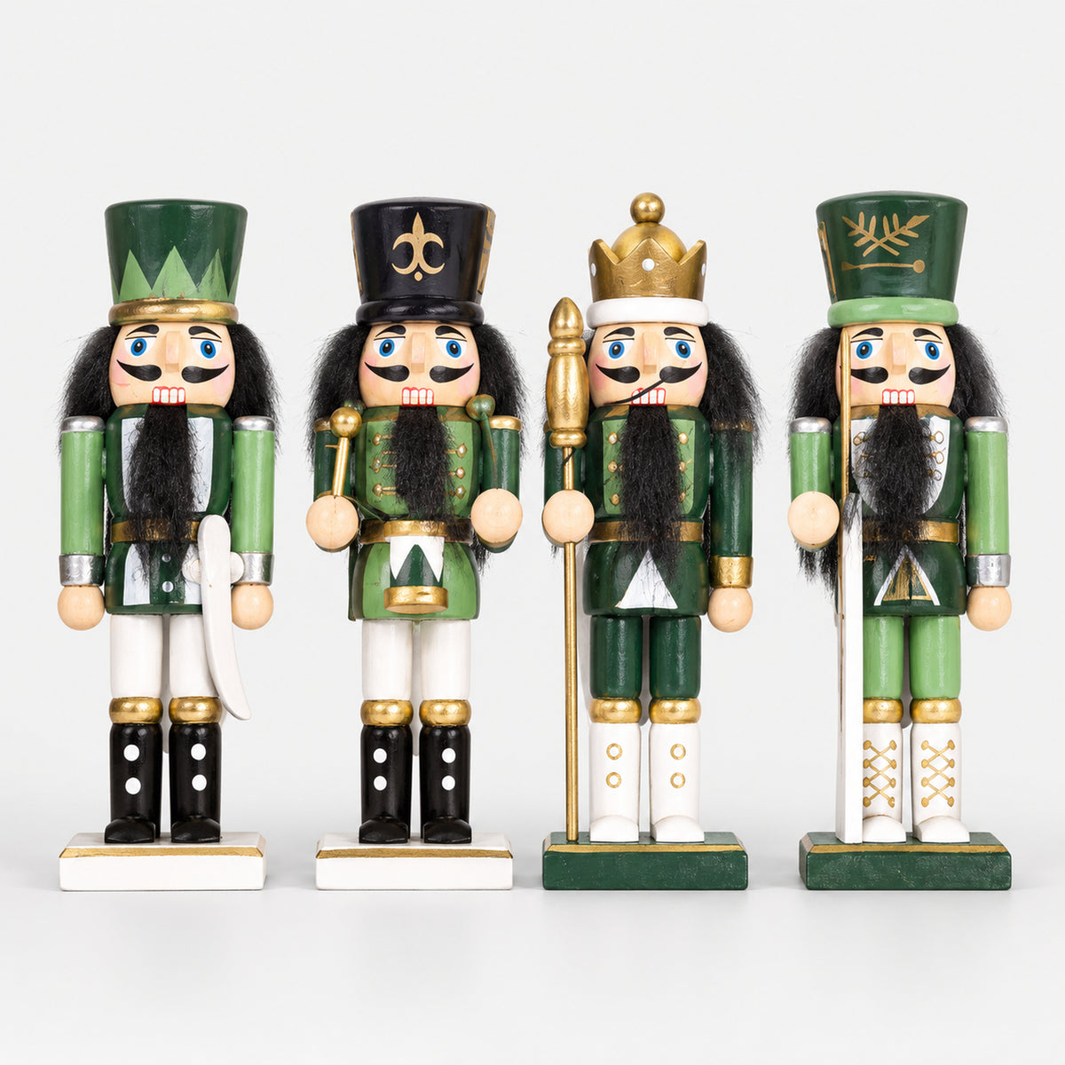 4 green and gold nutcracker soldier figures, including a king with a crown