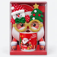 Christmas mug with red laughing Santa design and party glasses in a gift box