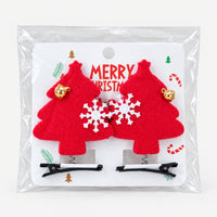 Red tree Christmas hair clips on a Merry Christmas card