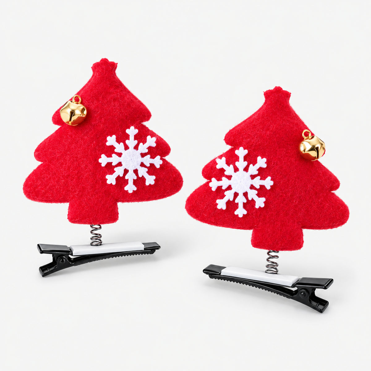 Pair of red felt Christmas tree hair clips with snowflakes and gold bells