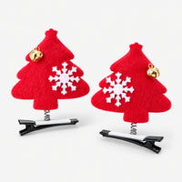 Pair of red felt Christmas tree hair clips with snowflakes and gold bells
