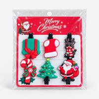Santa and gift Christmas hair clip set on a Merry Christmas card
