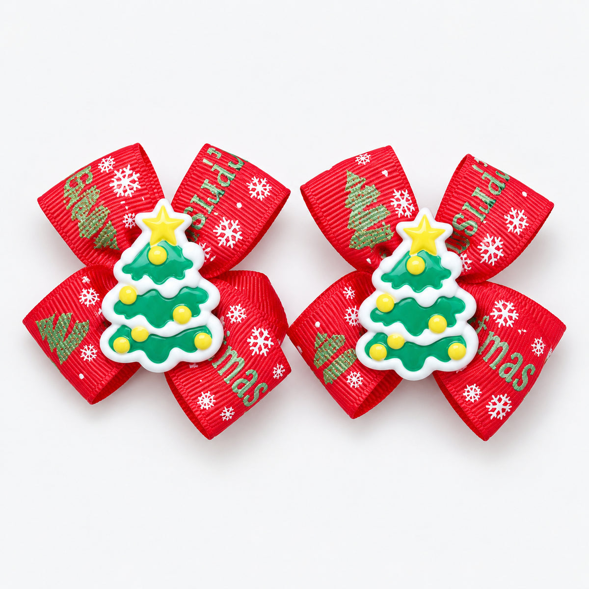 Pair of red Christmas bow hair clips with a Christmas tree charm