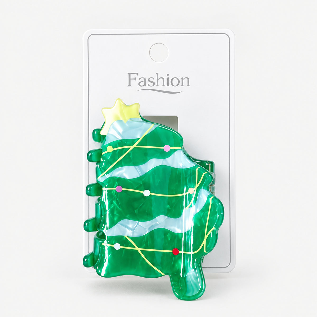Christmas tree hair clip on its display card