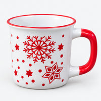 White Christmas camp mug with red snowflakes and a red handle