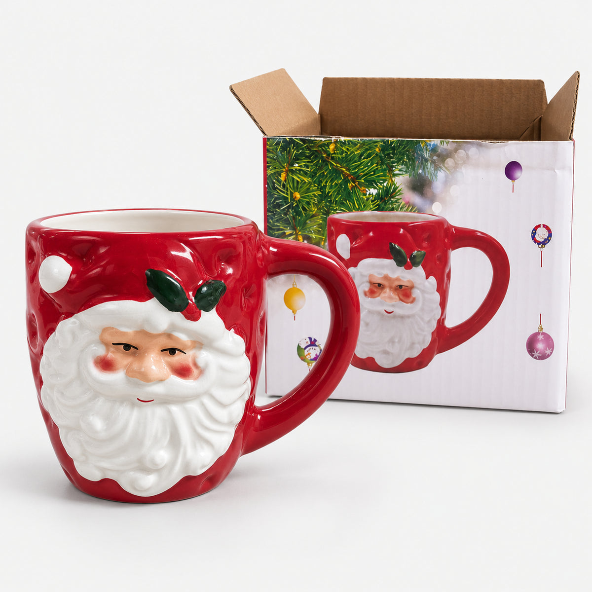 Santa holly Christmas mug next to its Christmas print gift box