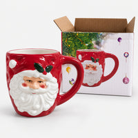 Santa holly Christmas mug next to its Christmas print gift box