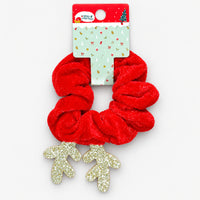 Christmas reindeer scrunchie on its Merry Christmas card