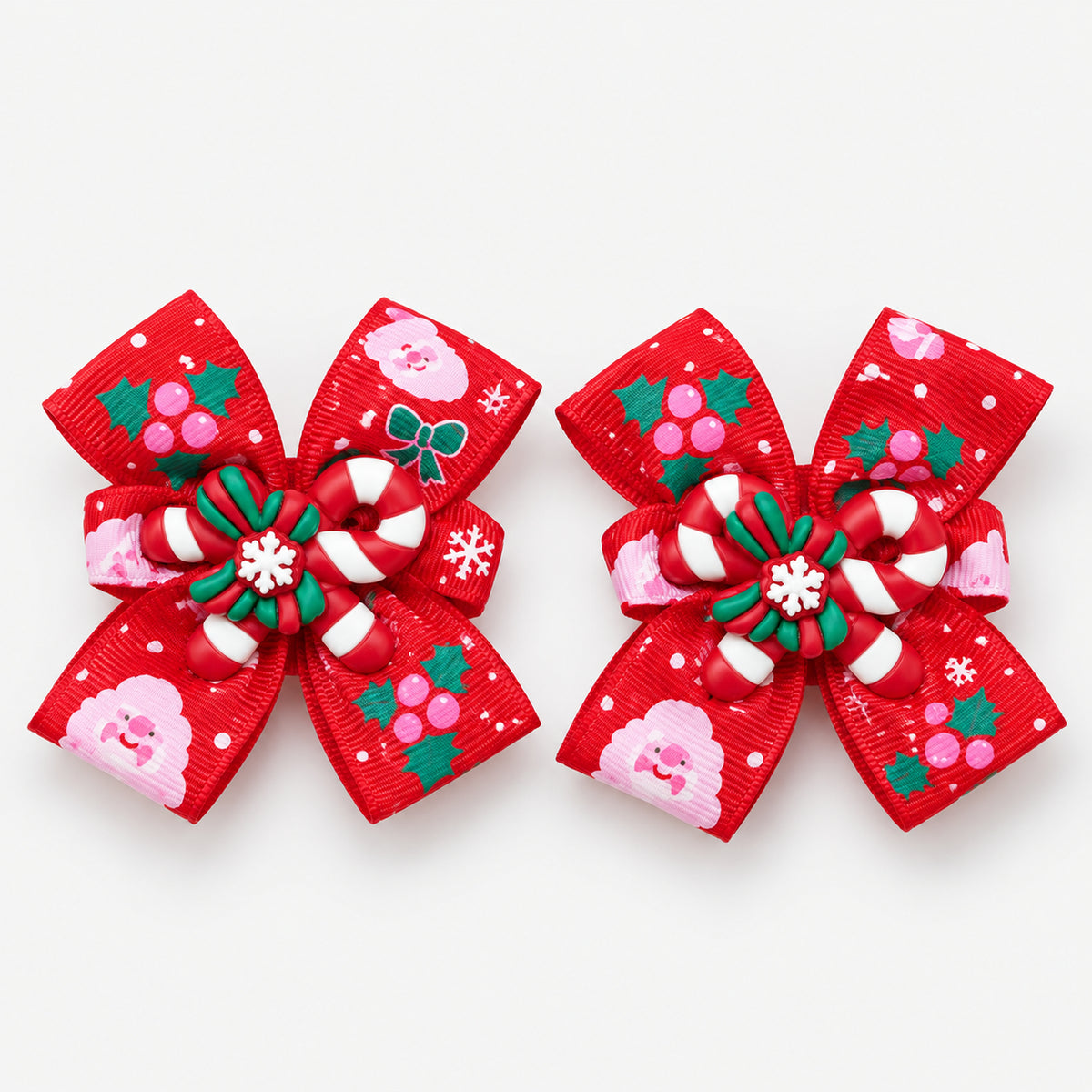 Pair of red Christmas bow hair clips with a candy cane and holly charm