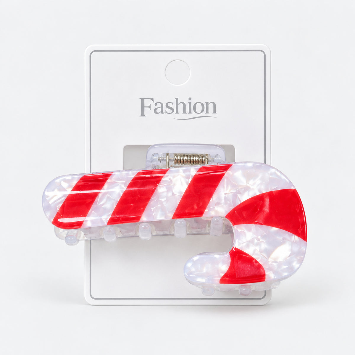 Candy cane Christmas hair clip on its display card
