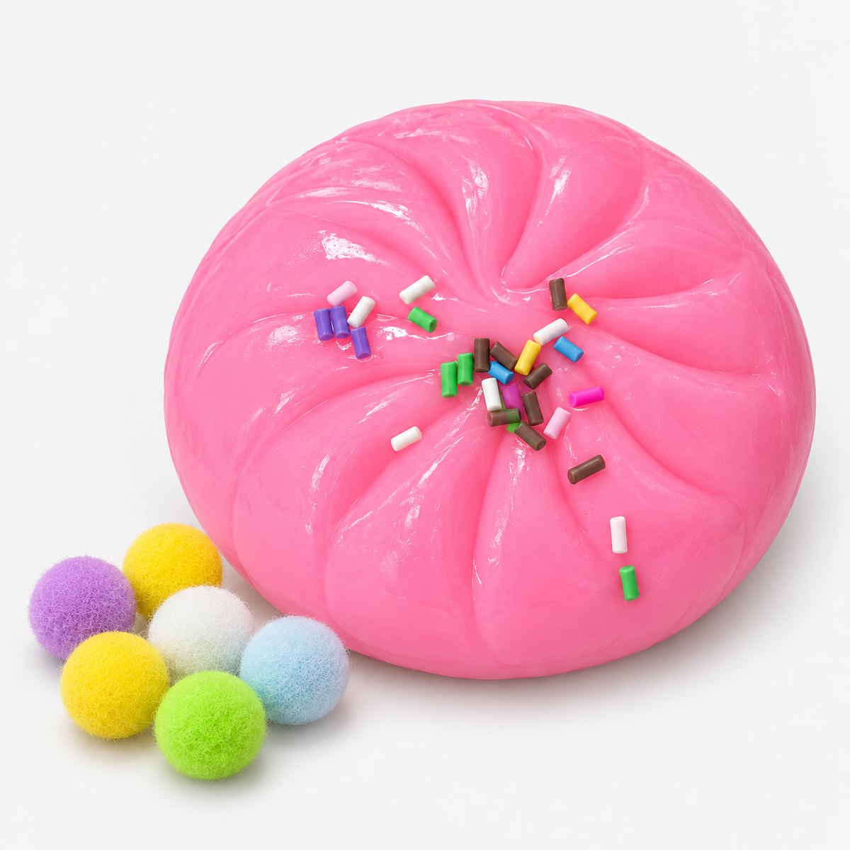 Dumpling squishy in pink with sprinkles and fuzzy pompoms