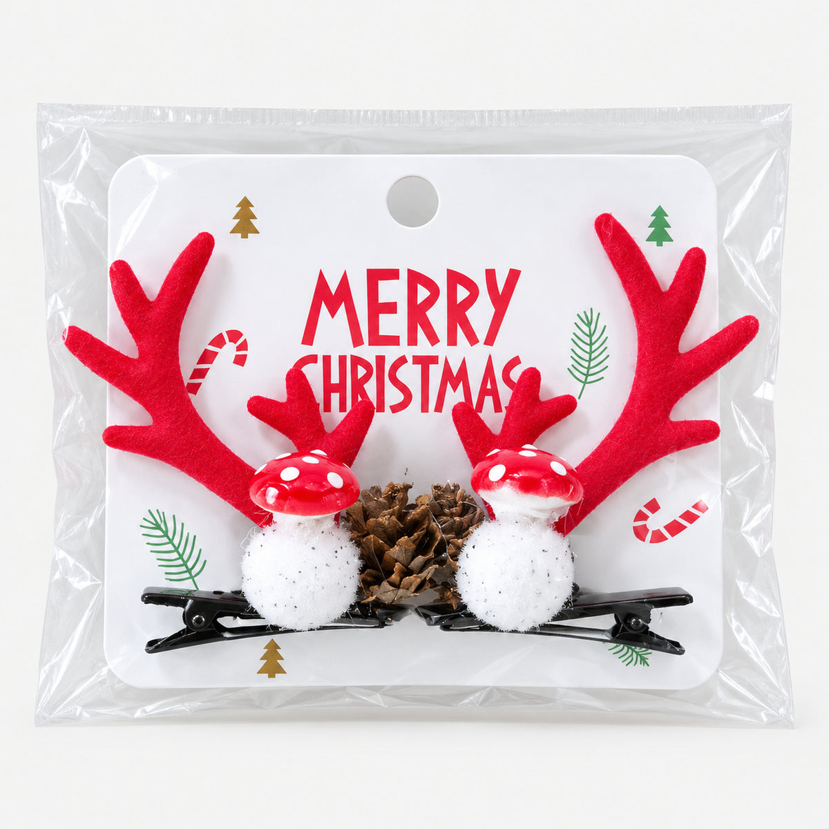 Red antler and mushroom Christmas hair clips on a Merry Christmas card