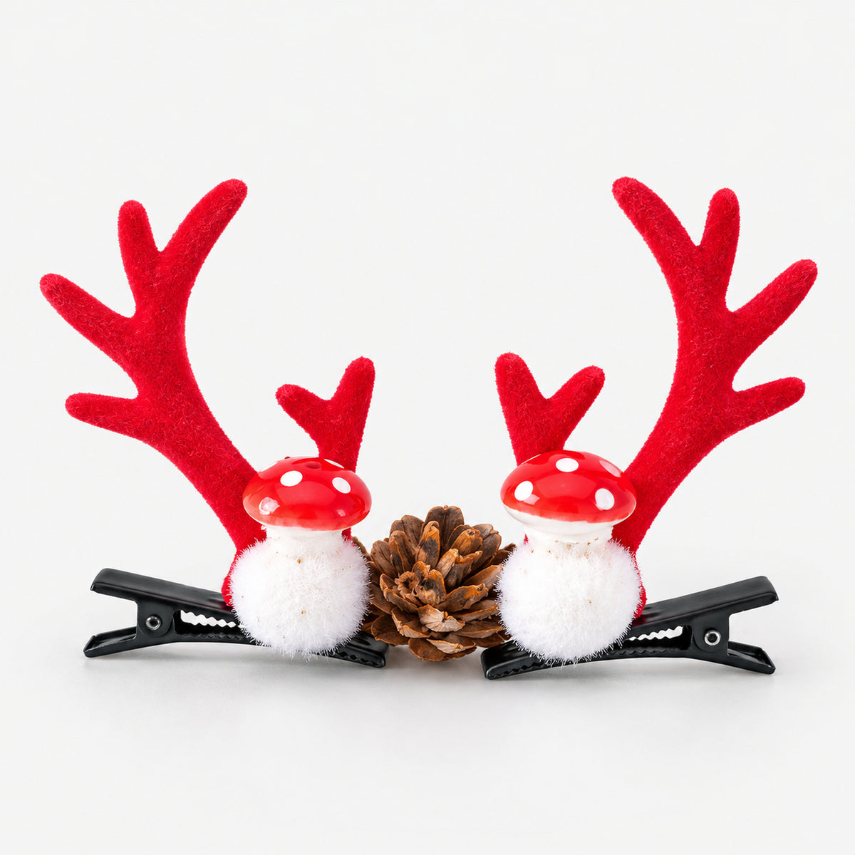 Pair of red antler Christmas hair clips with red and white mushrooms