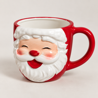 Red Christmas mug with a 3D smiling Santa face and white beard