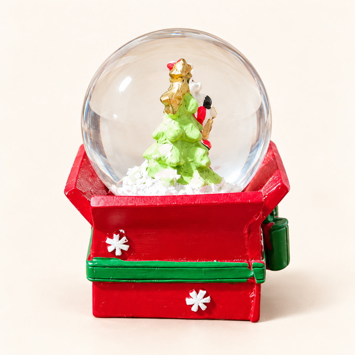 Mini Christmas snow globe with a Christmas tree on a red gift box base