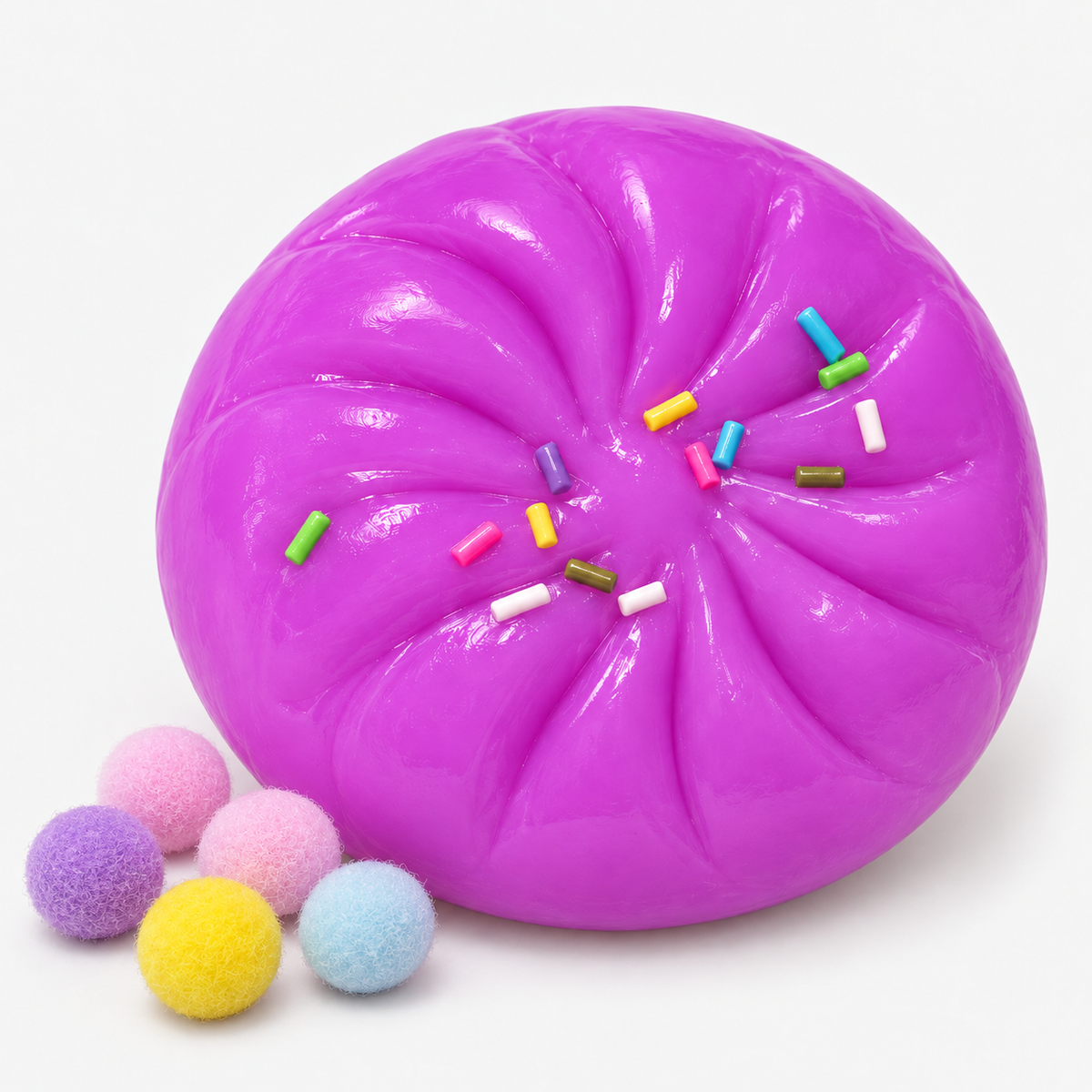 Dumpling squishy in purple with sprinkles and fuzzy pompoms