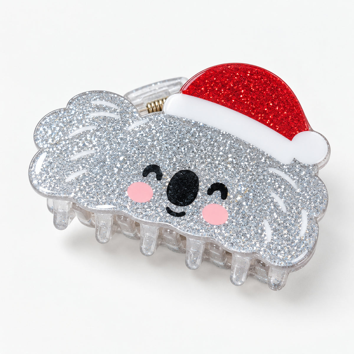Silver glitter koala claw hair clip wearing a red Santa hat