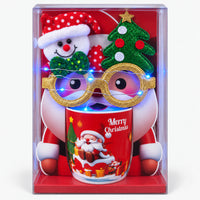 Christmas mug gift box with red Santa in snow design and light-up glasses switched on