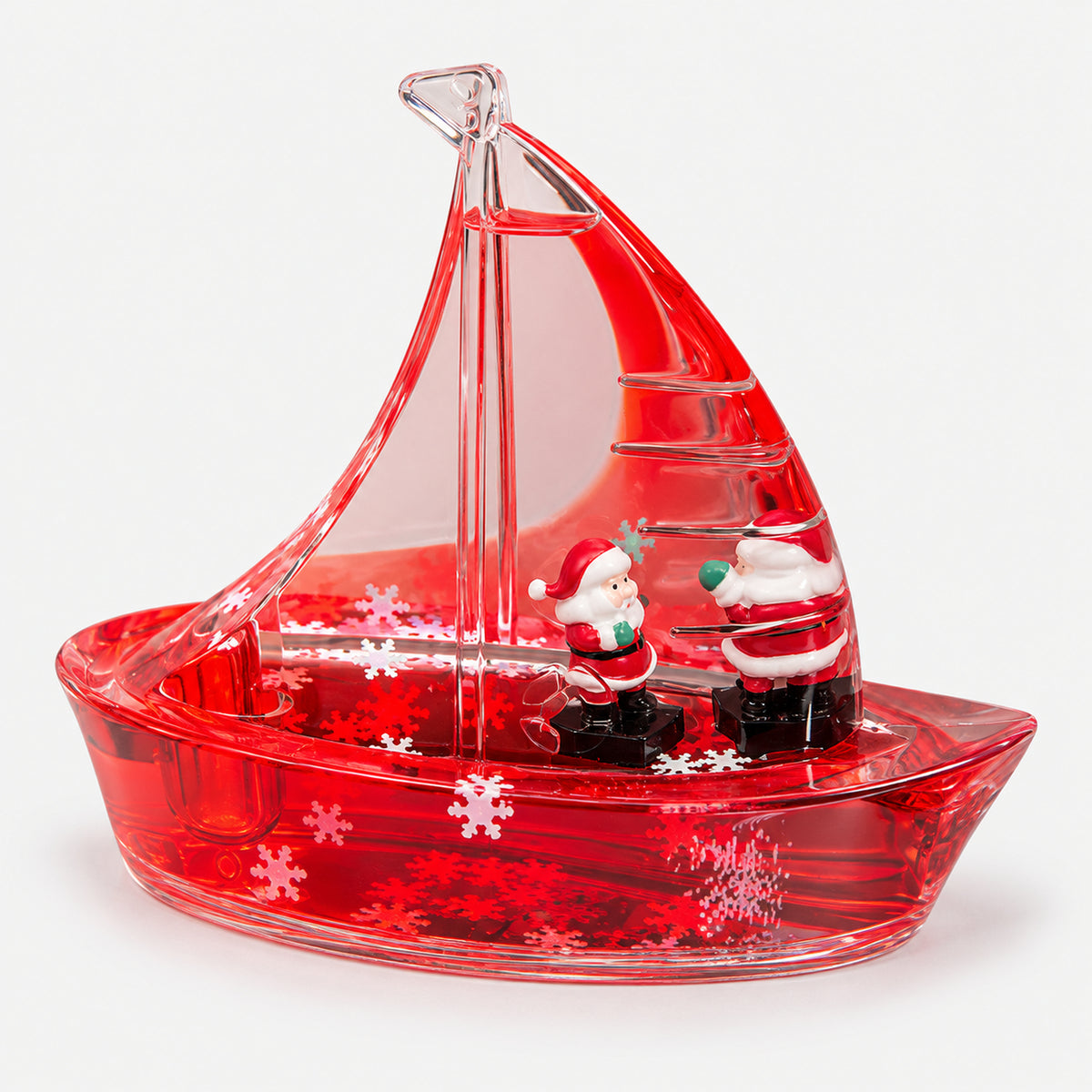 Christmas Sailboat Liquid Decoration with Santa on board and floating snowflakes in the hull