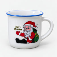 White Christmas mini mug with a blue rim and Santa with a green sack