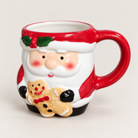 3D Santa Christmas mug with holly, holding a gingerbread cookie