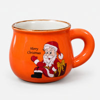 Orange rounded Christmas mug with Santa and a burgundy gift