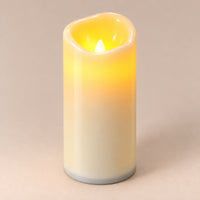 Ivory LED pillar candle, 15 cm, switched on with a warm flickering flame