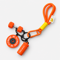 Orange gym fitness keychain with mini dumbbell, weight plate and shaker bottle
