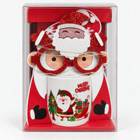 Christmas mug with white Santa and sleigh design and party glasses in a gift box