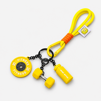 Yellow gym fitness keychain with mini dumbbell, weight plate and shaker bottle
