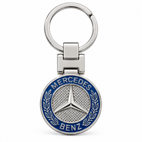 Metal car logo keychain with a round blue three-pointed star logo