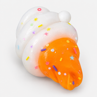 Ice cream swirl squishy in orange with sprinkles and star confetti